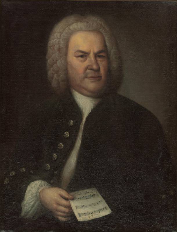 18th century painting of Johann Sebastian Bach. He wears a grey, curly wig and holds a piece of sheet music in his hand.
